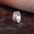 Load image into Gallery viewer, Close-up of sterling silver ring with a beautifully engraved lion hunting scene