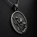 Load image into Gallery viewer, Close-up of St. Christopher medal necklace, patron saint of travelers.