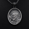 Load image into Gallery viewer, Close-up of 925 sterling silver Padre Pio pendant necklace on black background