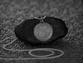 Load image into Gallery viewer, Close-up of oxidized Skyrim Zenithar medallion showing texture and detail.