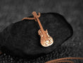 Bild in Galerie-Betrachter laden, Rose gold-plated music pendant with detailed guitar and skull figure,