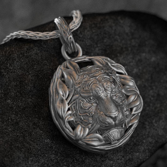Regal lion head pendant with laurel wreath,