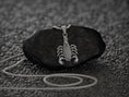 Load image into Gallery viewer, Close-up of armored scorpion pendant, bold gothic style.