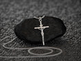 Bild in Galerie-Betrachter laden, Crucifix pendant on textured background, faith-inspired jewelry.