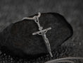 Bild in Galerie-Betrachter laden, Close-up of silver Jesus on cross necklace, spiritual jewelry.