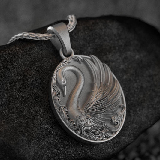 Close-up of elegant swan necklace, nature-inspired jewelry.