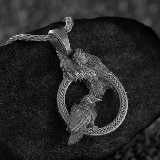 Close-up of 925 sterling silver Hugin and Munin Norse raven pendant necklace