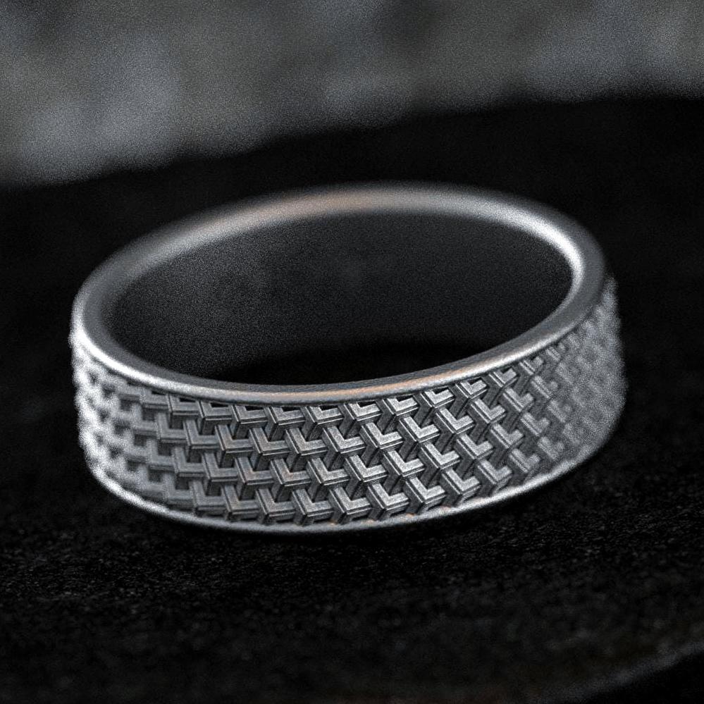 Matte oxidized silver wedding band with woven texture pattern
