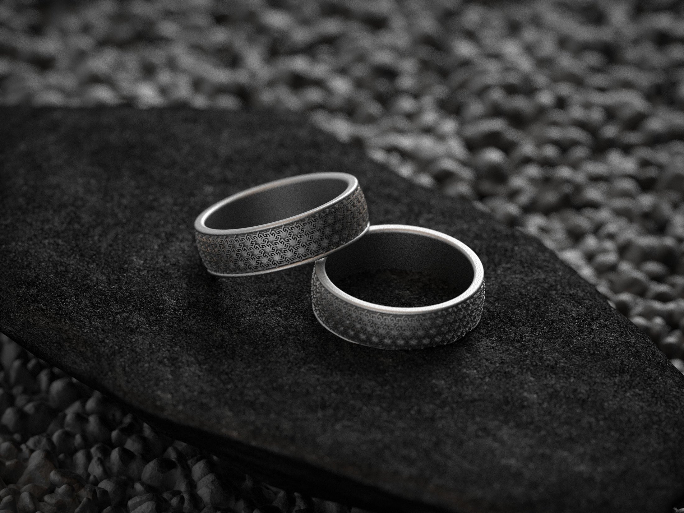 Pair of matte silver Greek key bands with engravable interiors