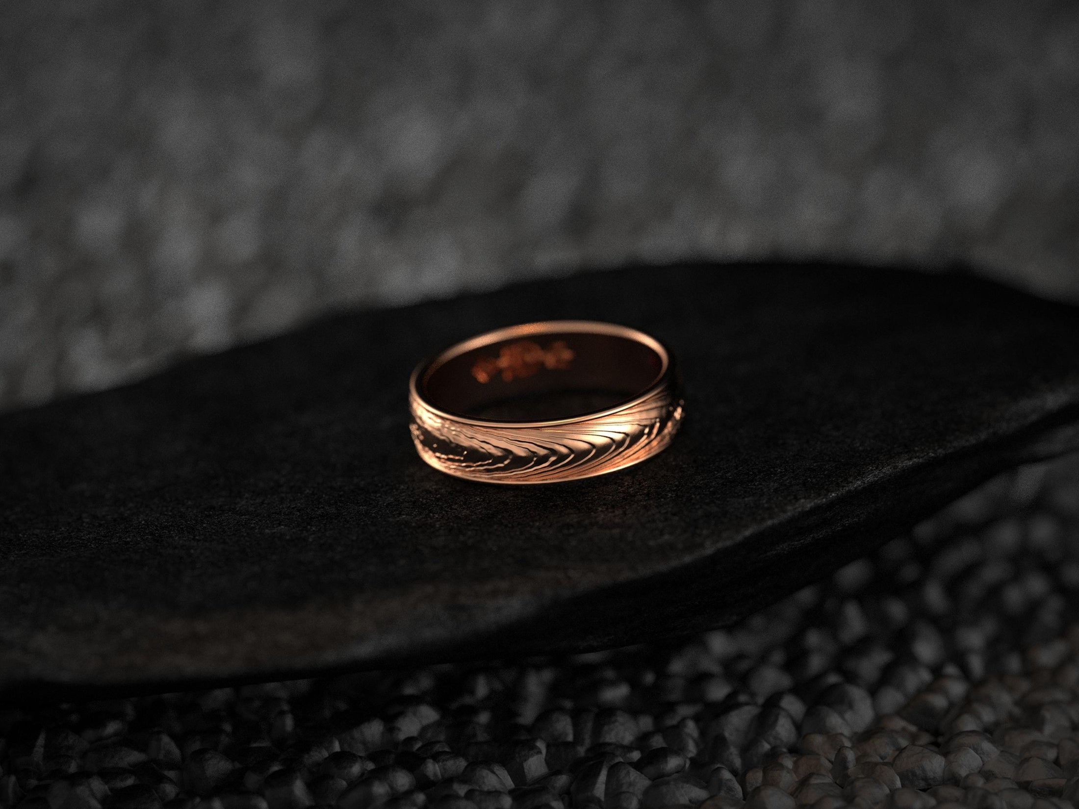 Rose gold ring with organic Damascus-inspired wave pattern