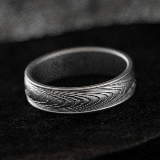Feather-pattern oxidized silver ring with Damascus-style texture