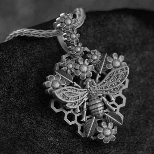 Nature-inspired bee pendant on stone,