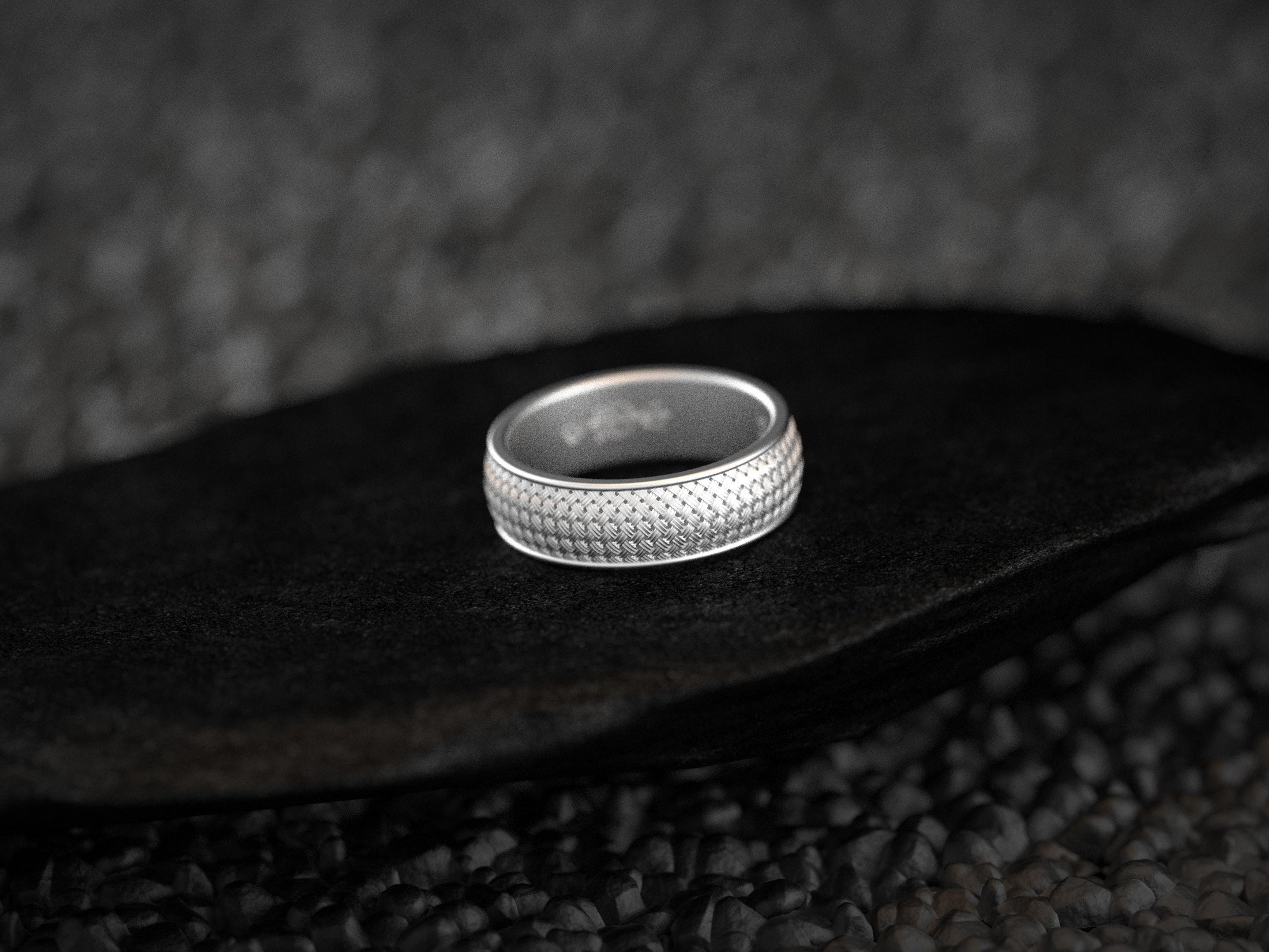 Textured silver band with weave design,