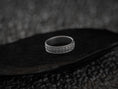 Load image into Gallery viewer, Oxidized silver starburst wedding band with engraved detail