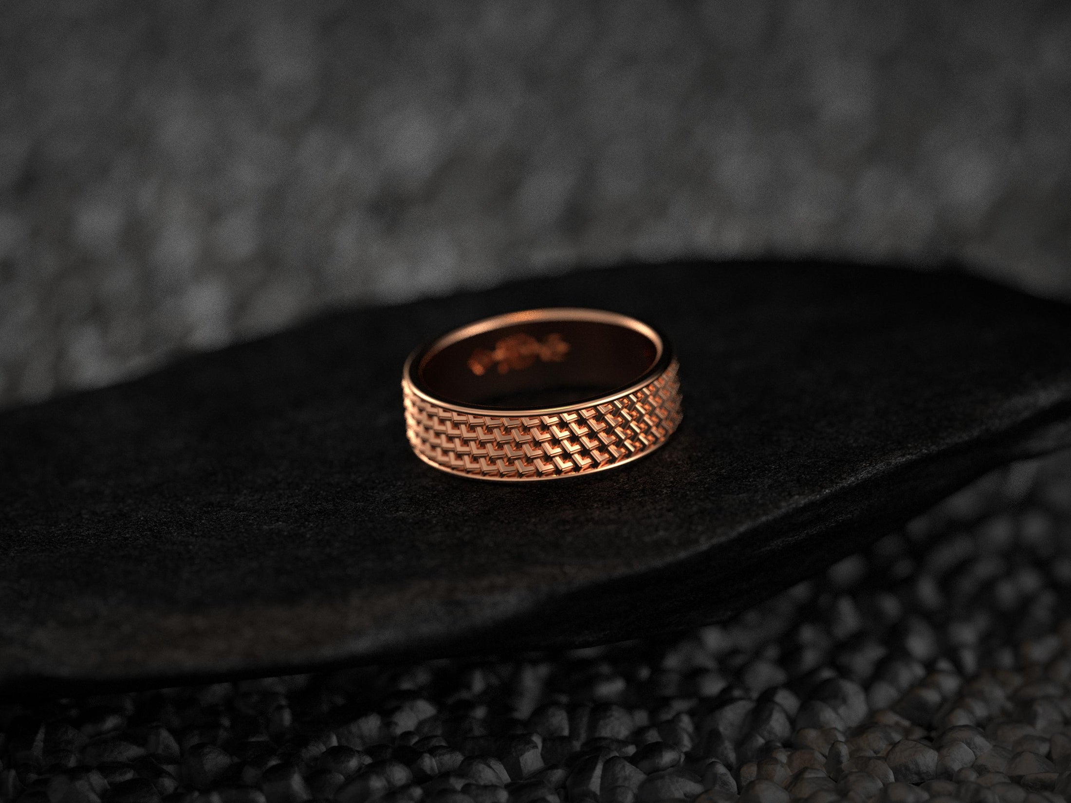 Rose gold men’s band featuring geometric basket weave detail