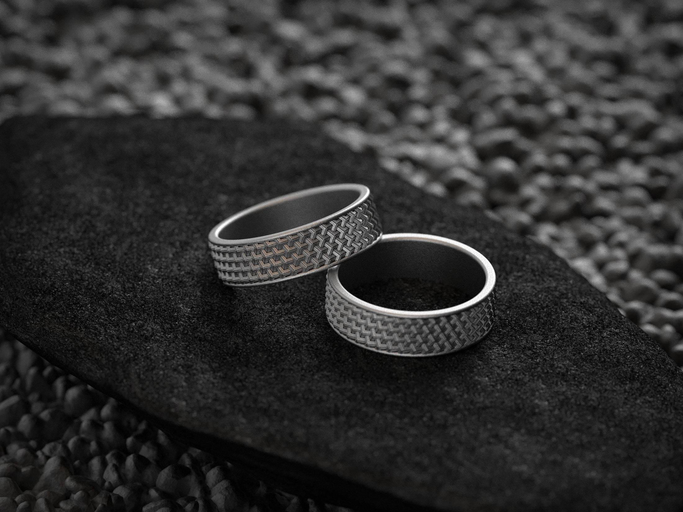Pair of dark silver textured wedding bands with comfort fit