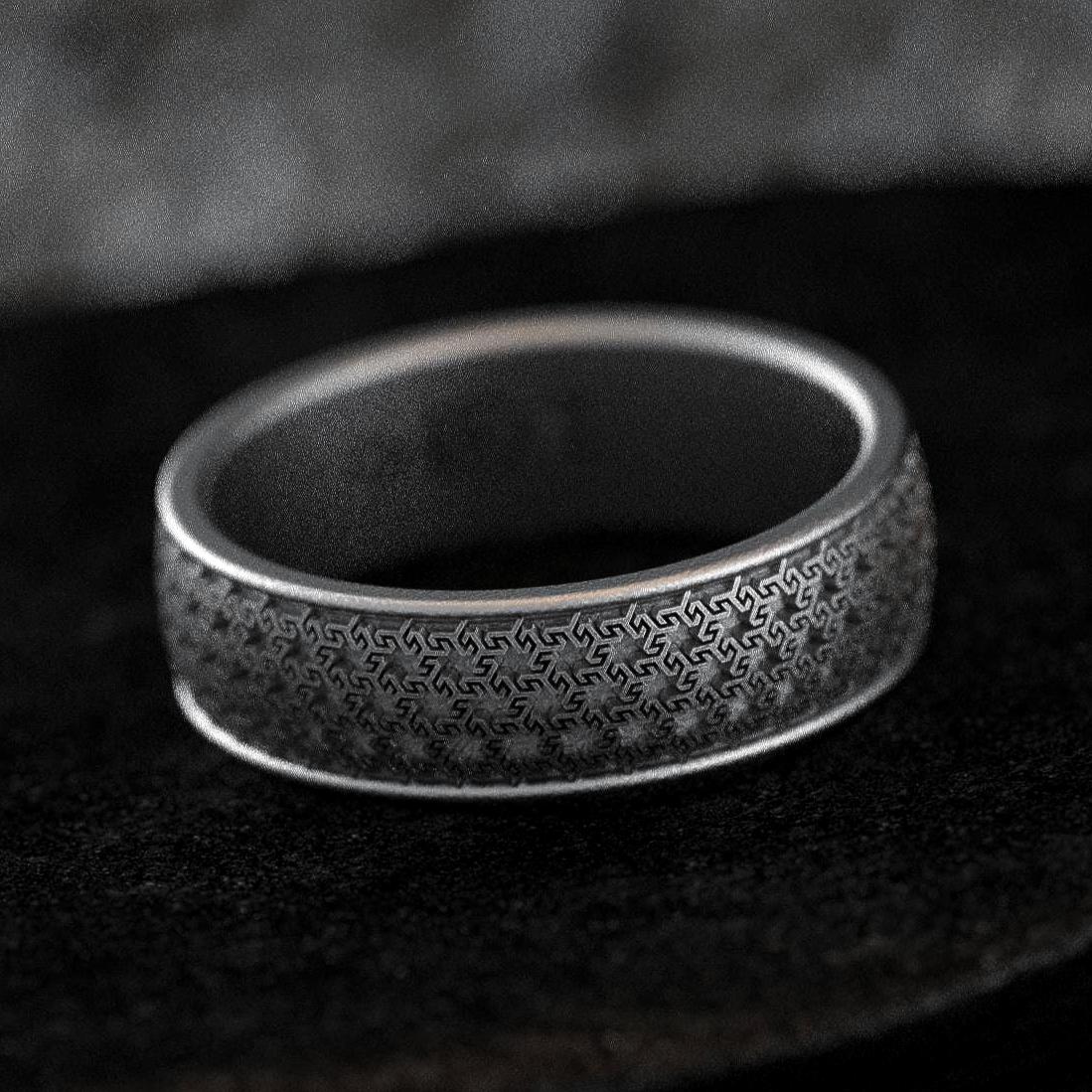 Oxidized silver wedding band with fine Greek key pattern