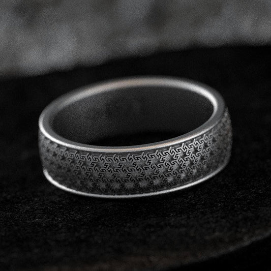 Oxidized silver wedding band with fine Greek key pattern