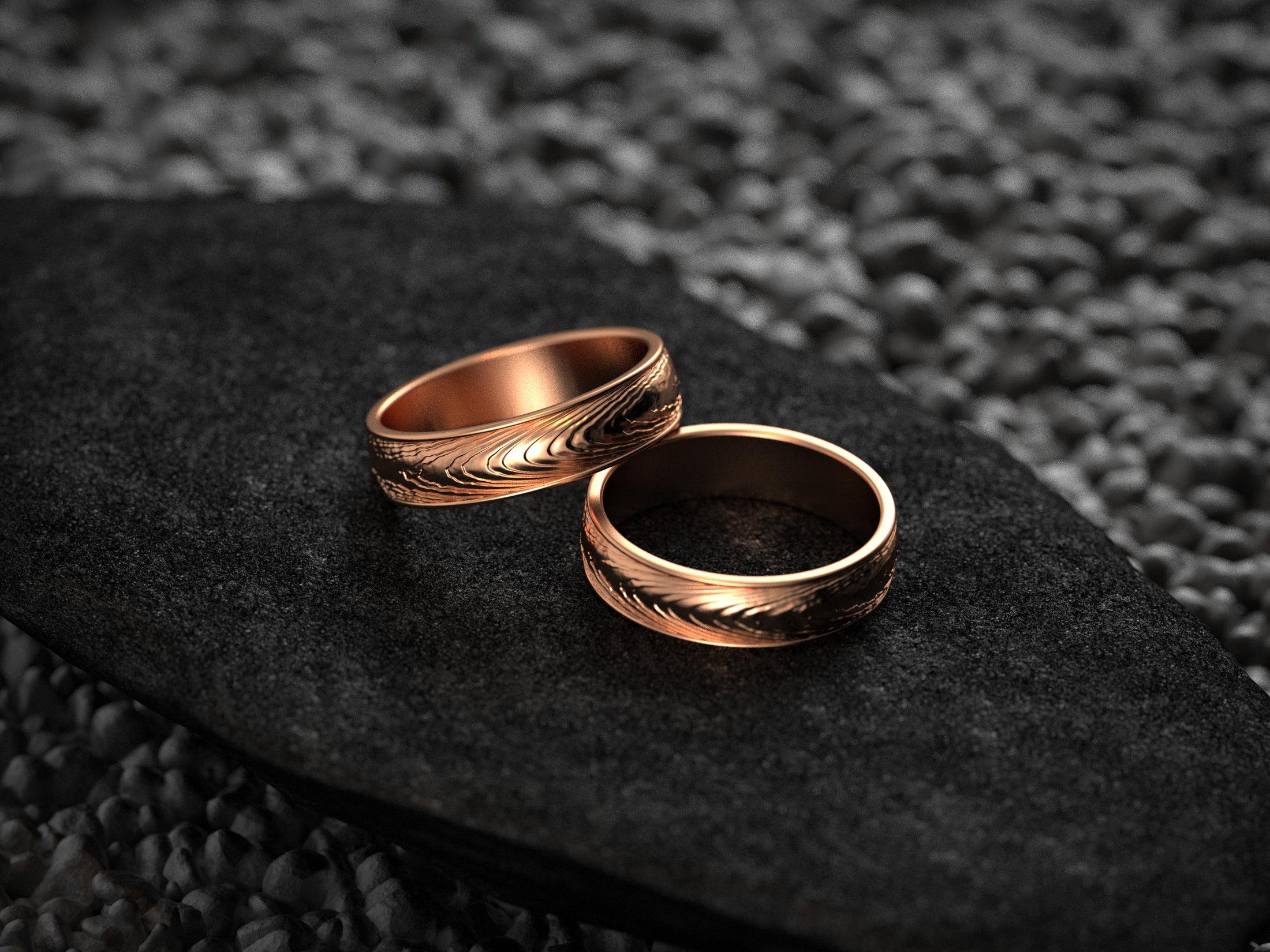 Rose gold matching wedding bands with engraved flow lines