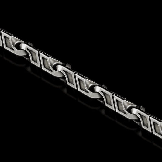 Greek meander chain necklace in silver on black background