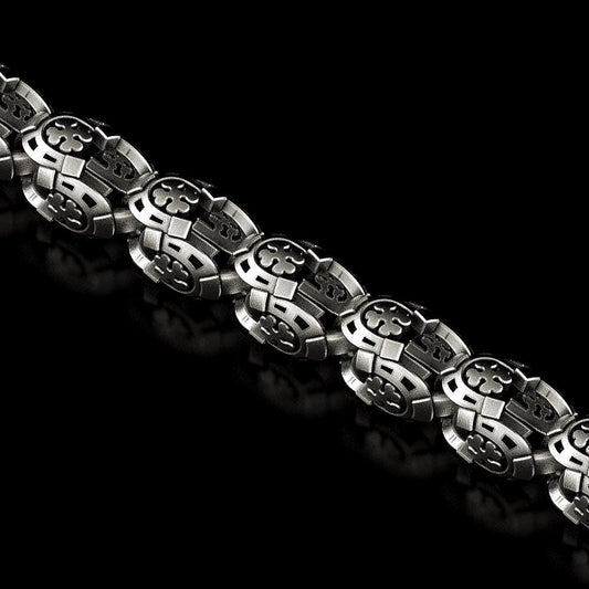 Solid silver four-leaf clover chain close-up