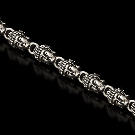 Close-up of Buddha head link in silver