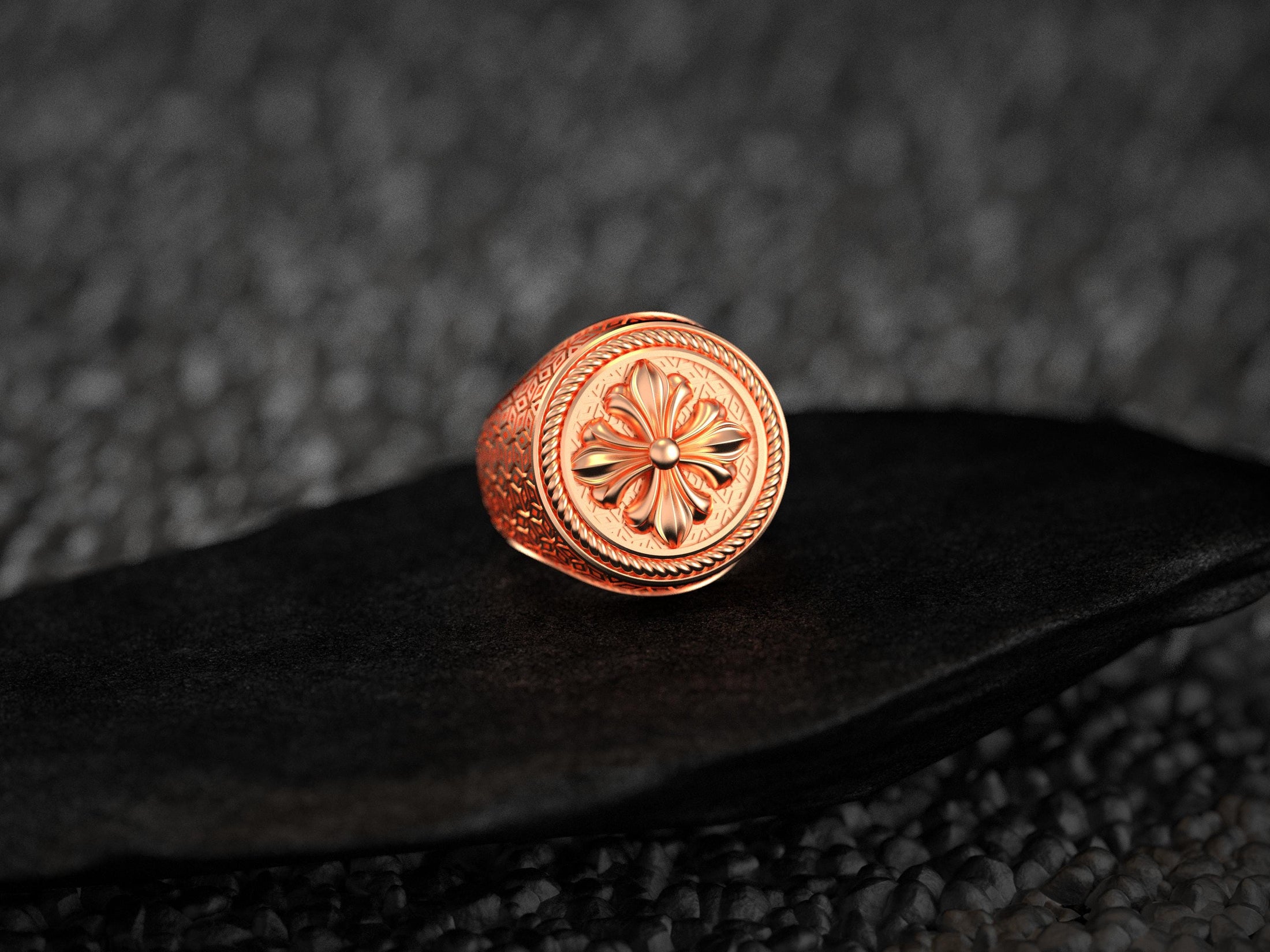 Rose gold plated fleur de lis round ring with textured shank,