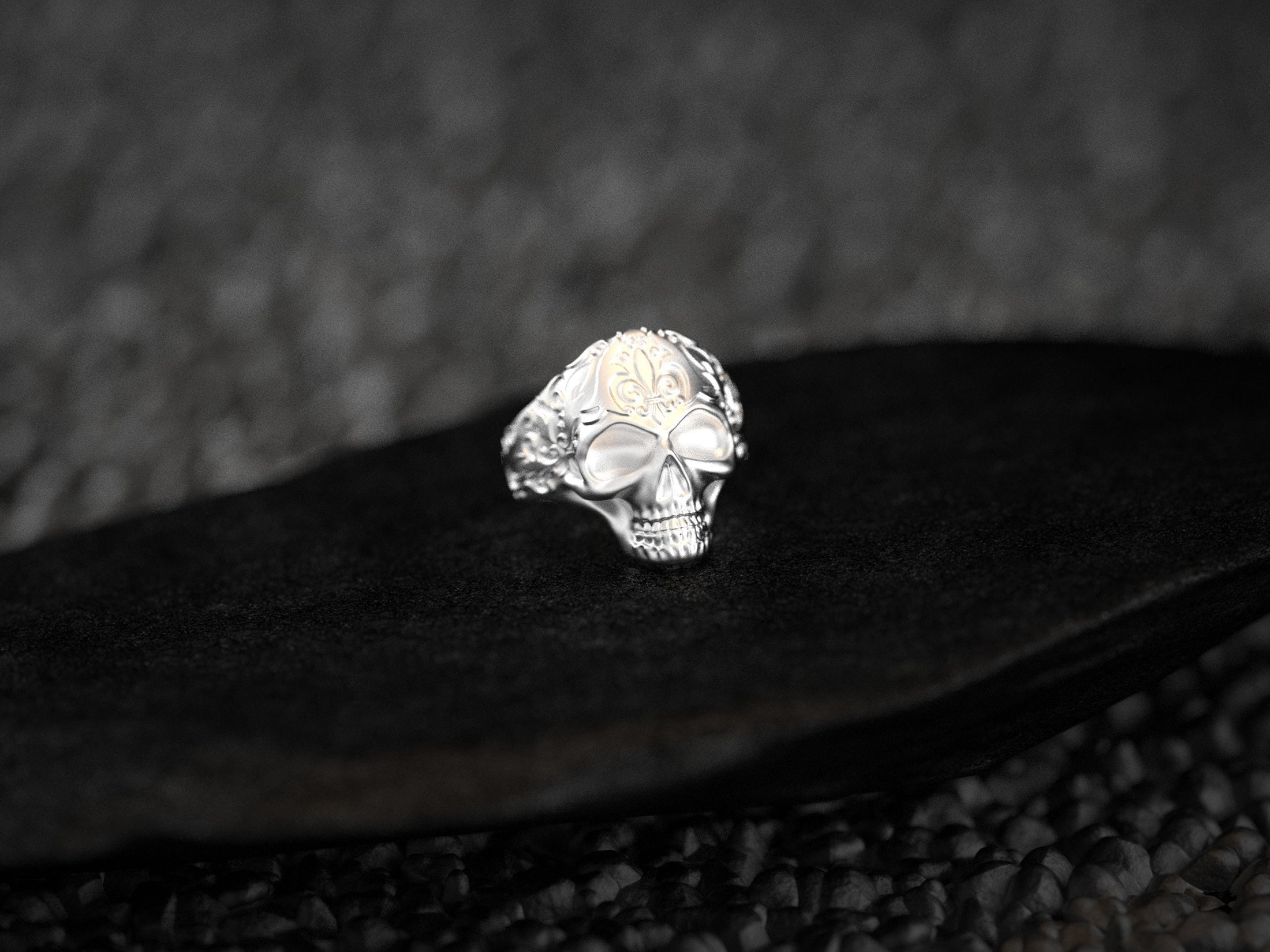 Head-on view of polished sterling silver skull ring.
