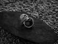 Load image into Gallery viewer, Side profile view of silver skull ring showcasing filigree ornament.