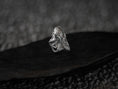 Load image into Gallery viewer, Angled view of silver octopus ring highlighting textured tentacles.