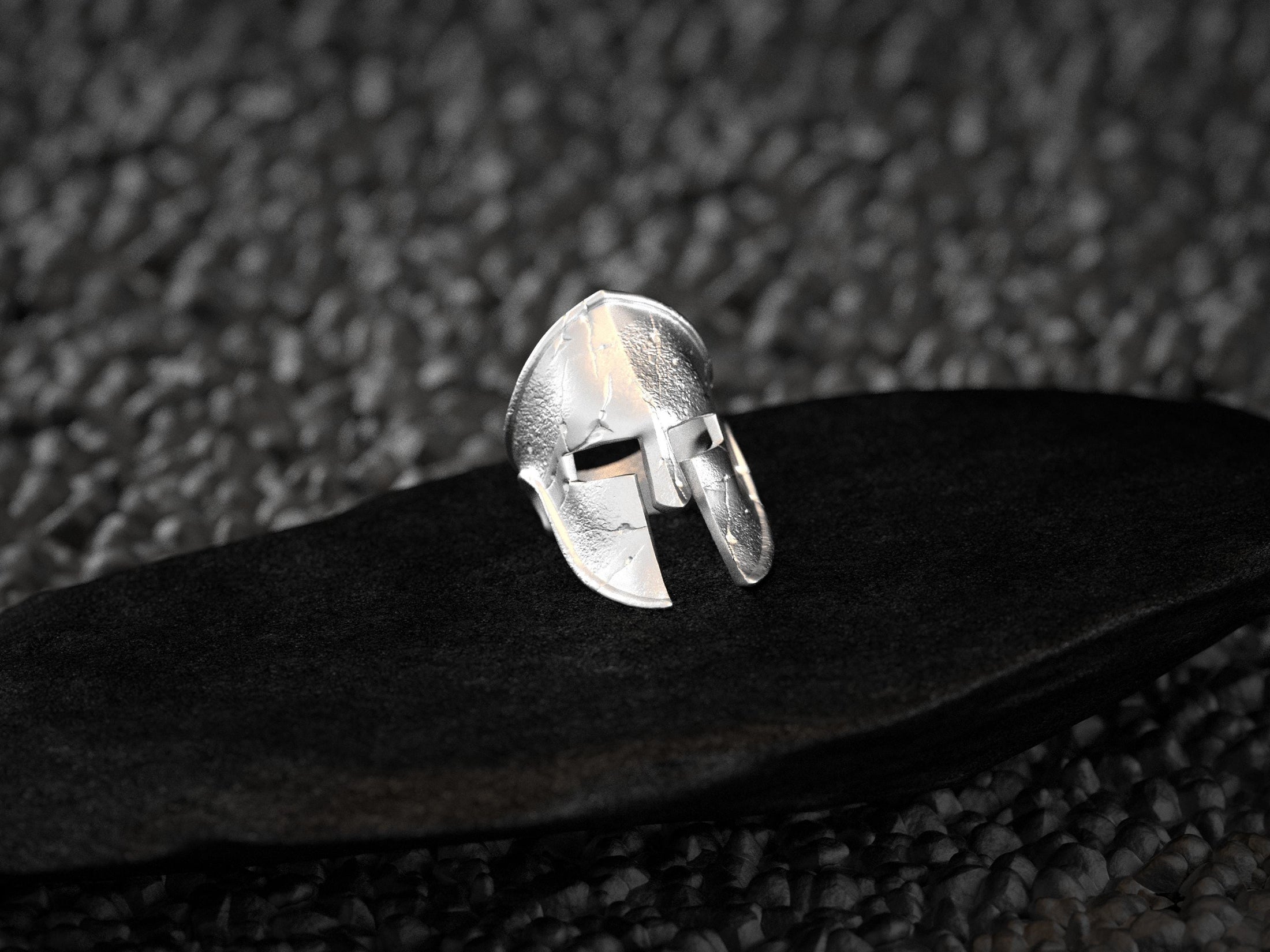 Front view of the polished sterling silver Spartan helmet ring showing realistic cracks and textured surface.