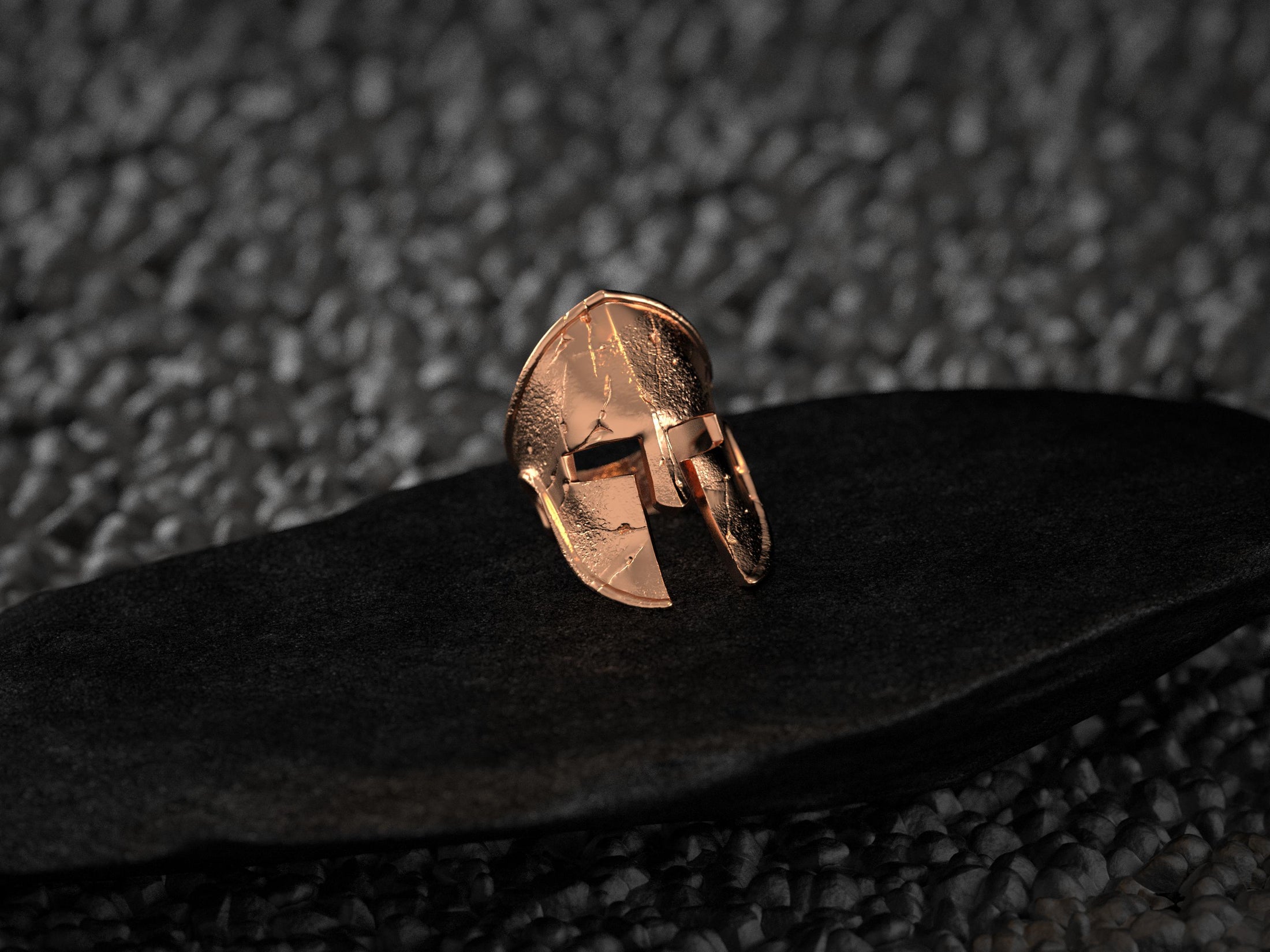Front view of the rose-gold plated variant, emphasizing its rosy metallic finish and rugged texture.