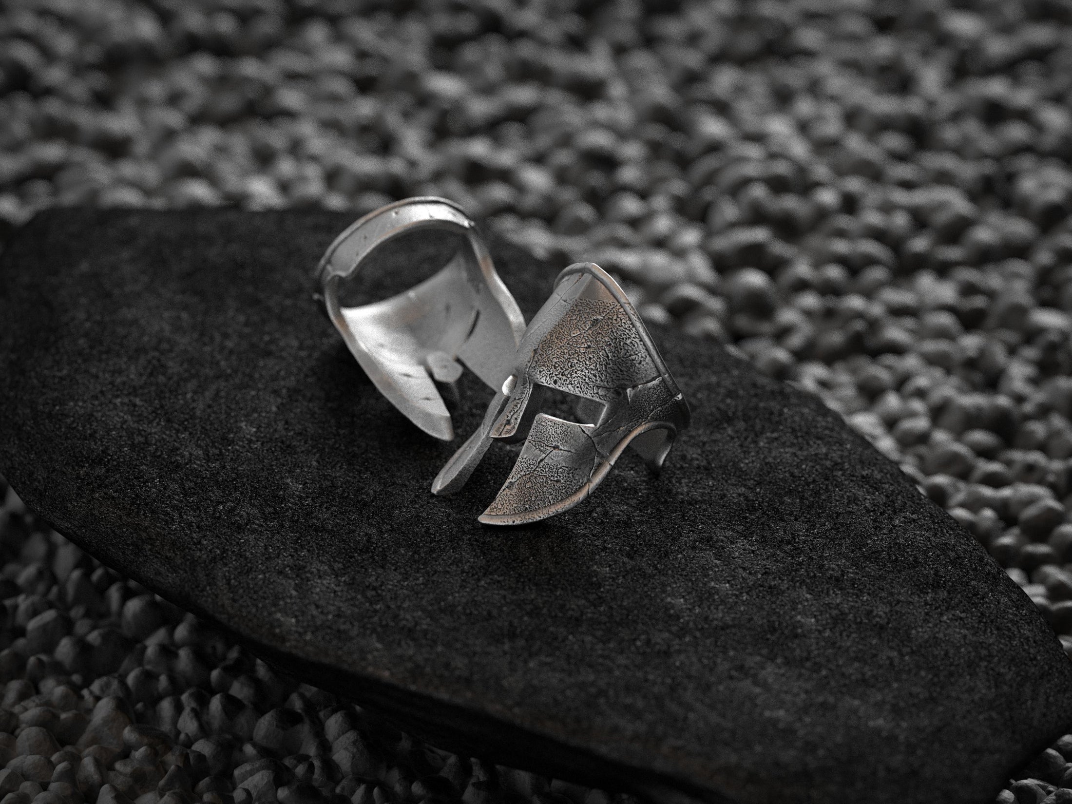 Close-up detail of the helmet’s distressed cracks and pitted surface in sterling silver.