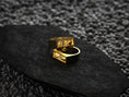 Load image into Gallery viewer, Angled shot of the yellow gold–plated ring, illustrating its warm metallic sheen and Gothic bar face.