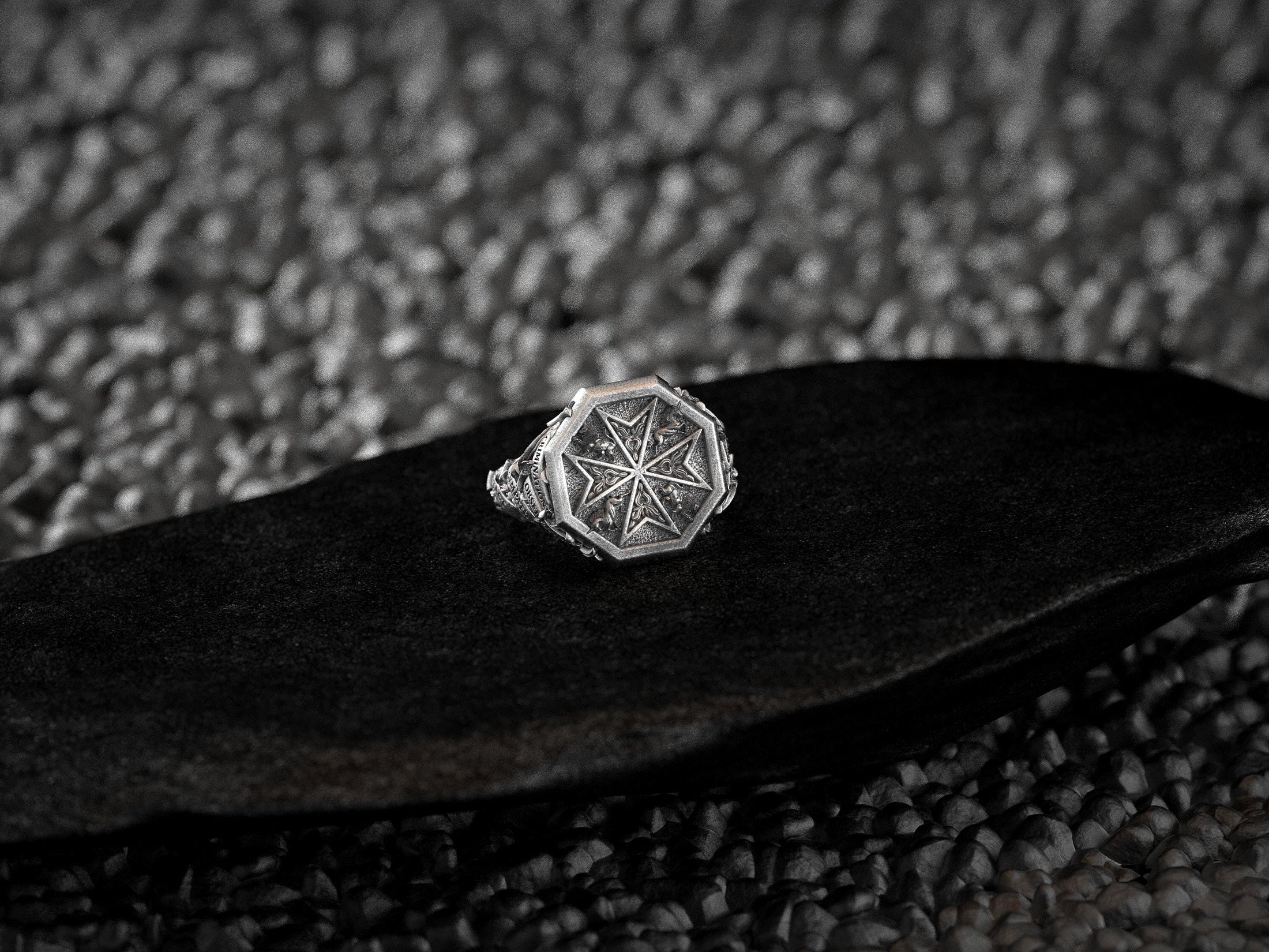 Close-up of Maltese Cross and medieval beast details on ring face