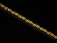 Load image into Gallery viewer, Gold-plated ornate chain necklace in warm lighting