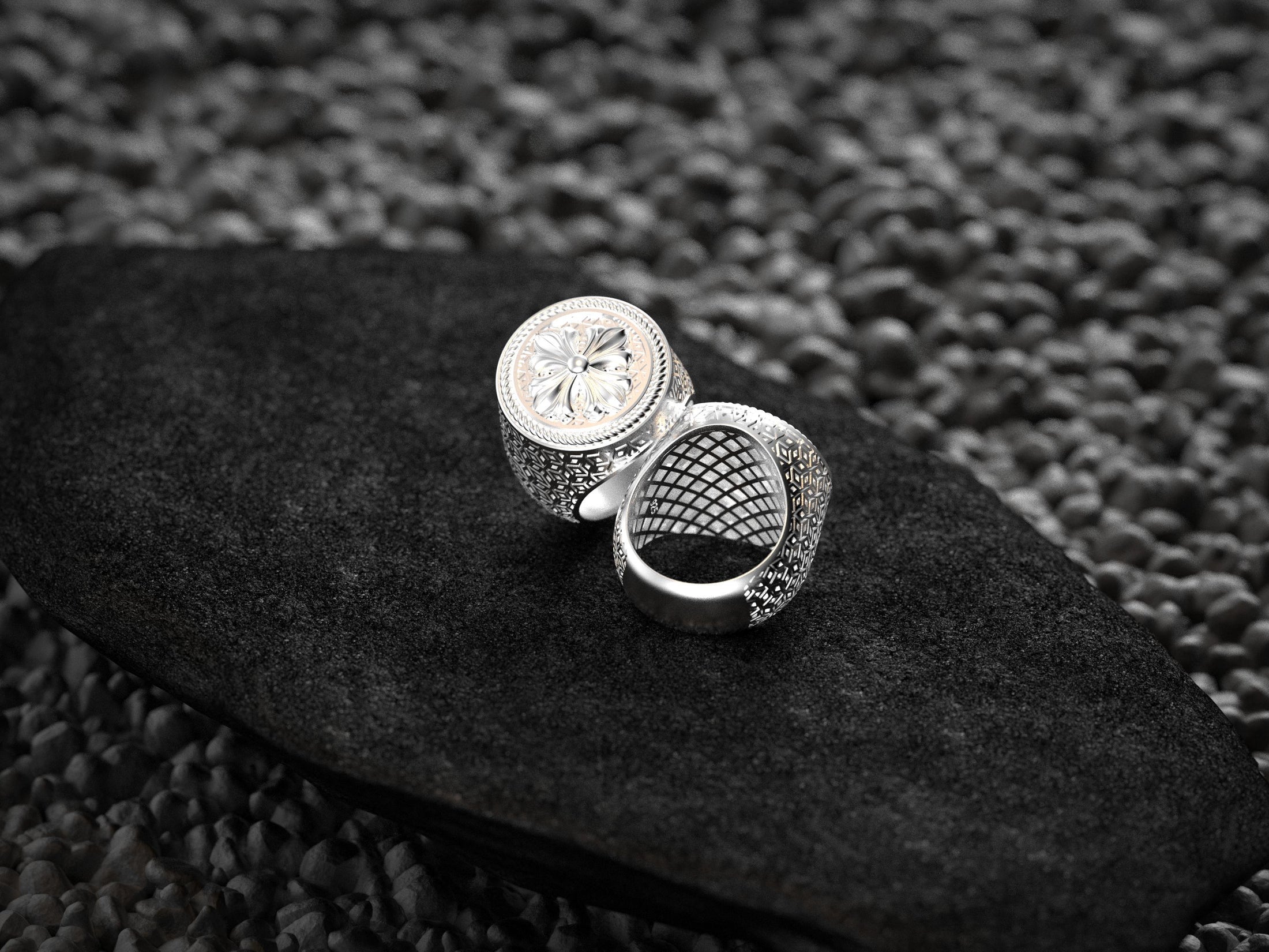 Detailed side texture of round silver men's crest ring,