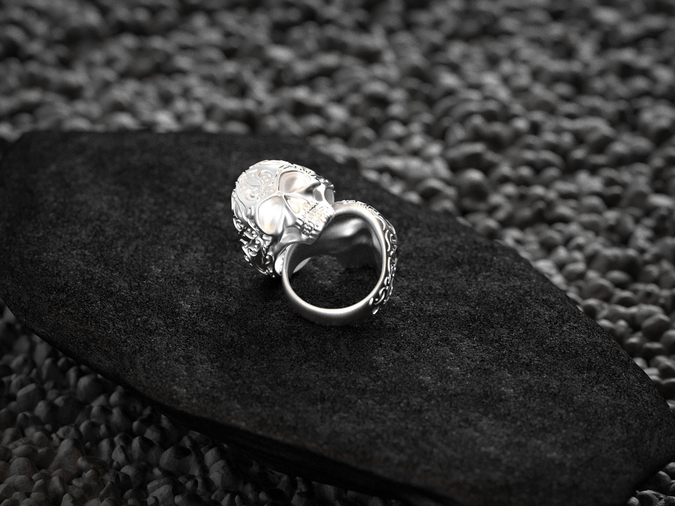Rear view of silver skull ring interior band.