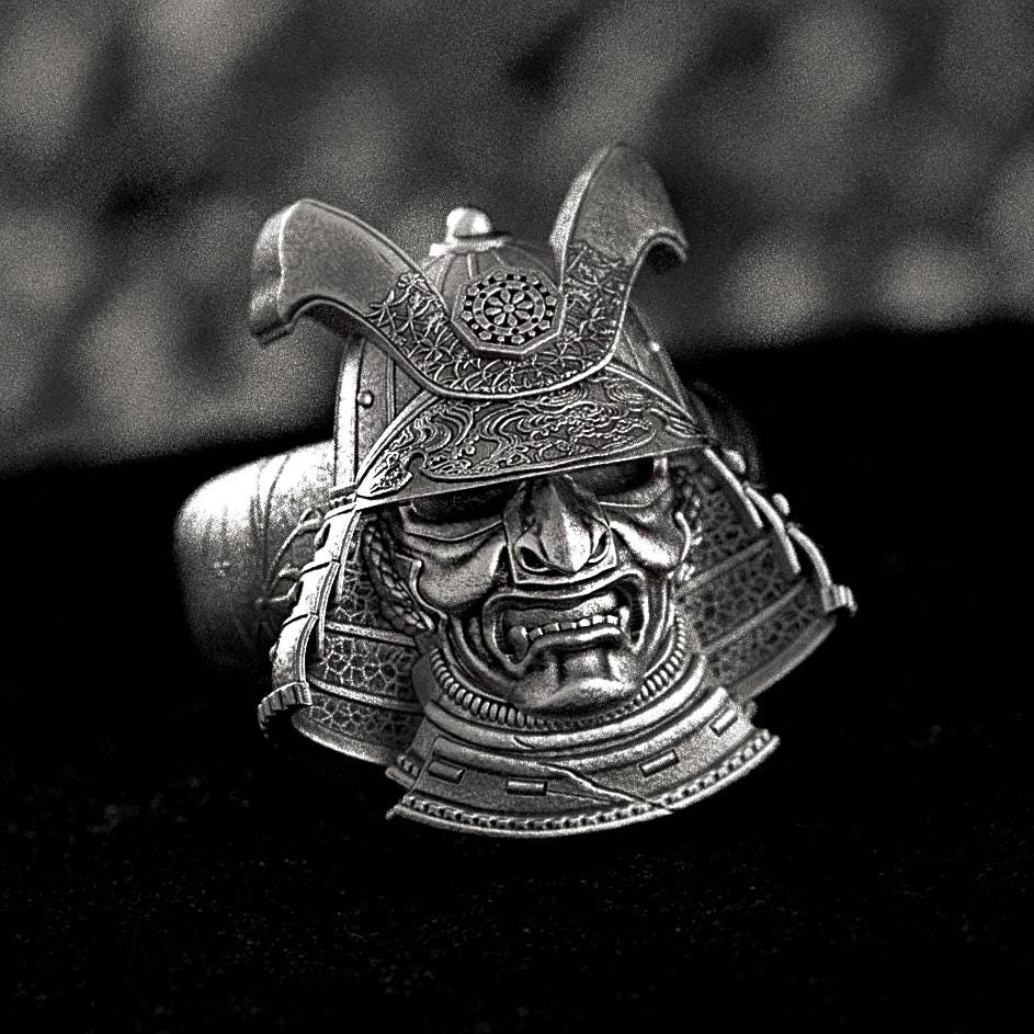 Front view of detailed samurai helmet ring with kabuto armor design.