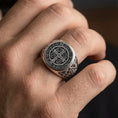 Load image into Gallery viewer, Oxidized sterling silver St Benedict ring worn on finger, Benedict medal seal face, Catholic protection ring for daily wear