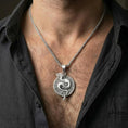 Load image into Gallery viewer, Polished silver yin yang dragon pendant worn on chest highlighting spiritual balance dragon jewelry