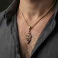 Load image into Gallery viewer, Rose gold plated dragon shield pendant worn on model as mythic dragon jewelry