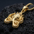 Load image into Gallery viewer, Gold plated Lovecraft octopus pendant showcased on volcanic rock as an ancient eldritch power symbol