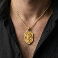 Load image into Gallery viewer, Gold plated gothic dragon pendant necklace worn by man as bold statement jewelry