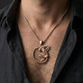Load image into Gallery viewer, Rose gold plated xenomorph pendant necklace worn on model with dark futuristic horror style