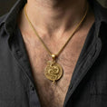 Load image into Gallery viewer, Gold plated yin yang dragon necklace worn by man emphasizing mythical dragon symbolism