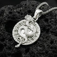 Load image into Gallery viewer, Polished silver yin yang dragon medallion necklace featuring taoist balance symbol on volcanic stone background