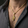 Load image into Gallery viewer, Gold plated dragon shield necklace worn by man showcasing gothic fantasy armor pendant