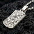 Load image into Gallery viewer, Polished silver chinese dragon dog tag necklace on volcanic stone background with mythic relief
