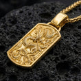 Load image into Gallery viewer, Gold plated eastern dragon dog tag pendant displayed on volcanic rock as power symbol jewelry